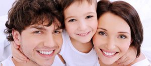 Male, Child and Female smiling