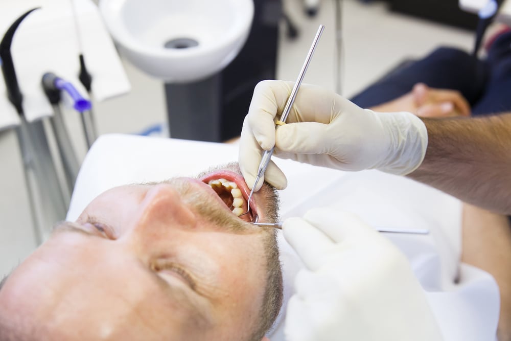 Male patient having a root canal treatment