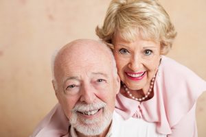 Smiling couple with dentures