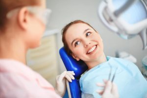 Smiling patent in a dentist chair