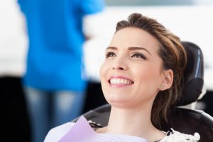 Calm and smiling patient in a doctors chair