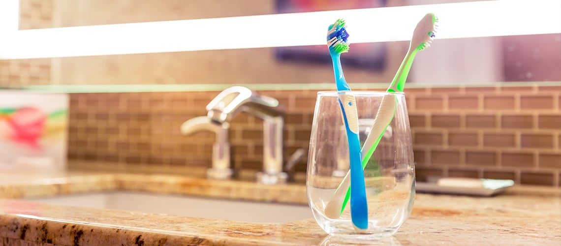 Basics Oral Hygiene - Toothbrushes in bathroom