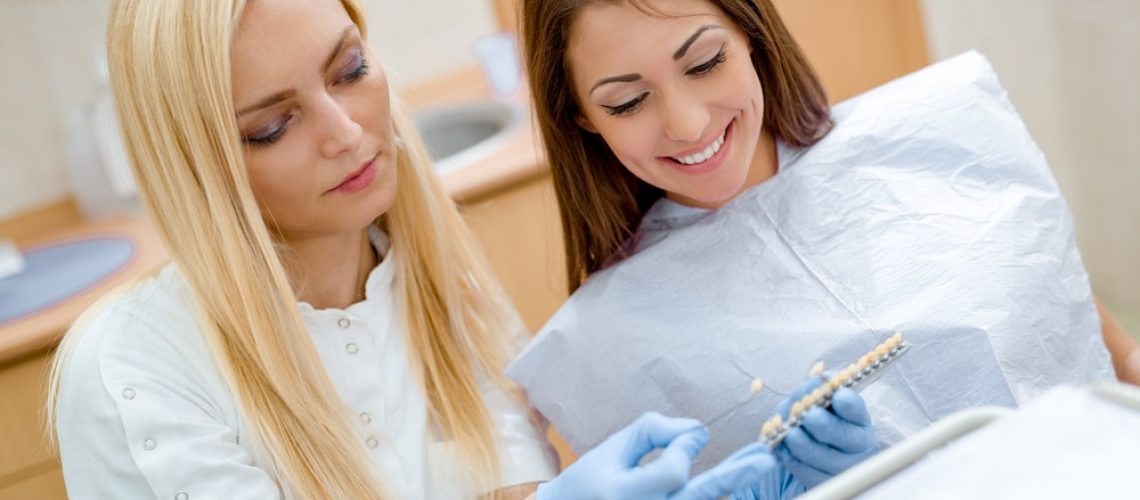 Dentist and patient in consultation